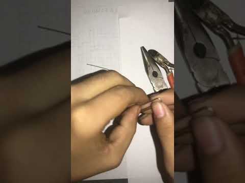 How do you make a fishing hook with a paper clip?